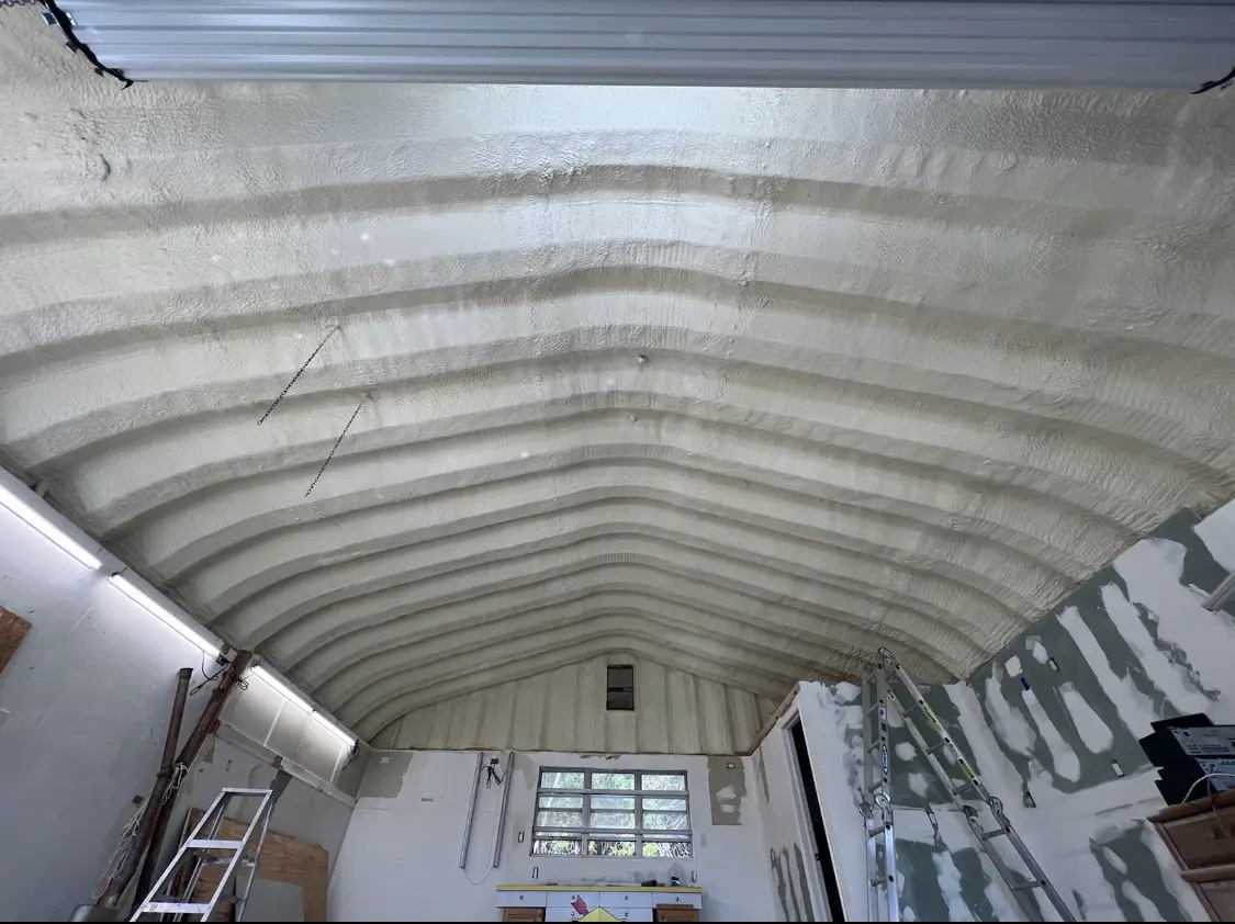 Spray polyurethane foam applied to the underside of a metal roof deck in Edgartown